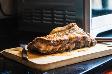 Close up Juicy homemade Pork Rib Meat on Top of Wooden Cutting Board