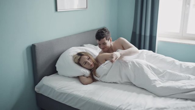 Trouble in bed. Couple relationship. Woman with headache doesn't want to have intimacy with her husband. Man wants to have sex. Thinking about divorce. Quarrel, family, sex coflict, libido concept