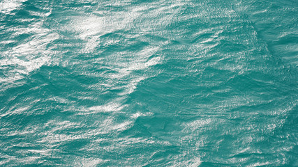 Fototapeta na wymiar Pure turquoise smooth water surface aerial view