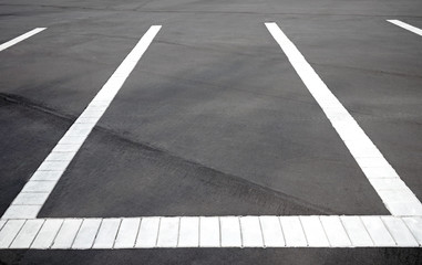 Parking markings in a parking lot for cars.