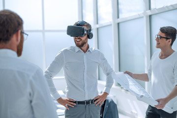 Fototapeta premium smiling designer looking at his virtual project