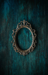 Metal oval frame on a wall