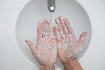 Washing hands rubbing with soap man for corona virus prevention, hygiene to stop spreading...