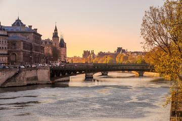 Paris, France - April 5, 2020: 20th day of containment because of Covid-19 in front of La Conciergerie and bridge over Seine river in Paris