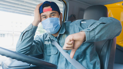Truck drivers wear a medical facemask for protection. During the coronavirus outbreak