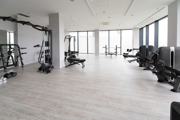 Fototapeta na wymiar Modern Gym Interior With Equipment