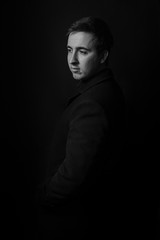 Young man's portrait. Close-up face. Black and white portrait