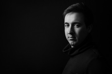 Young man's portrait. Close-up face. Black and white portrait