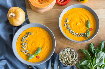 Delicious pumpkin carrot cream soup in a bowl