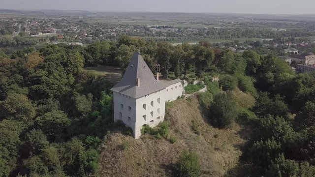 Aerial view of ruined medieval Halych Castle on the hill at sunny day, Halych, Ivano-Frankivsk region, Ukraine