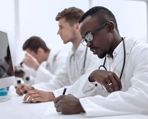 Fototapeta premium group of doctors sitting in the laboratory