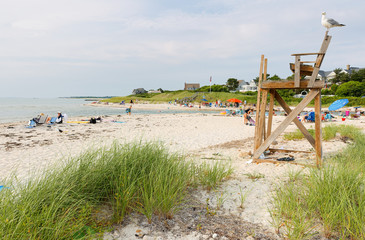 The wood Neck Beach in Galmouth on Cape Cod at sunset. This warm water beach is found at the mouth of a saltwater lake (Little Sippewissett Lake).