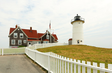 Nobska lighthouse at Cape Cod on a cloudy day. Nobska Light,  is a lighthouse located at Massachusetts on the southwestern tip of Cape Cod, 
