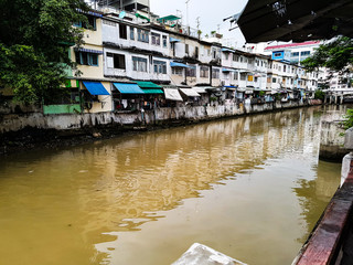 Poor house appartment at dirty water river in Asia Bangkok Thailand