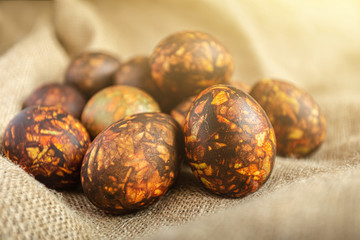 Colored Easter eggs background in warm colors