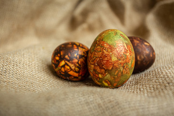 Colored Easter eggs background in warm colors