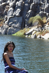 Spectacular middle eastern young woman is posing on  the Nile 