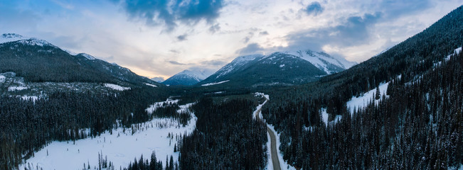 Aerial Panoramic View of a Scenic Road in the Canadian Mountain Landscape during a cloudy springtime sunset. Taken between Pemberton and Lillooet, BC, Canada.