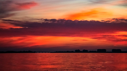 Naklejka na ściany i meble Red, orange sunset, water, reflection, skyline, horizon, Siesta Key, Sarasota, Florida