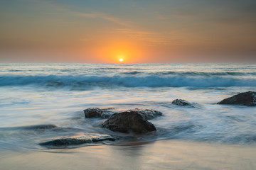Fototapeta na wymiar Soft Sunrise Seascape with some light cloud