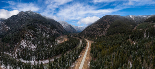 Aerial Panoramic View of a Scenic Road in the Canadian Mountain Landscape during a cloudy springtime. Taken between Pemberton and Lillooet, BC, Canada.
