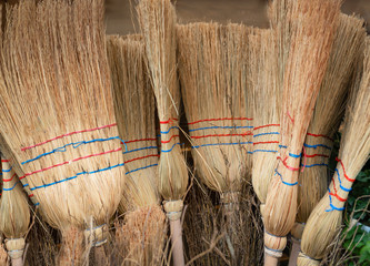 Traditional homemade brooms for sale at holiday market.