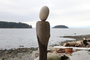 Balancing rock on coastal beach