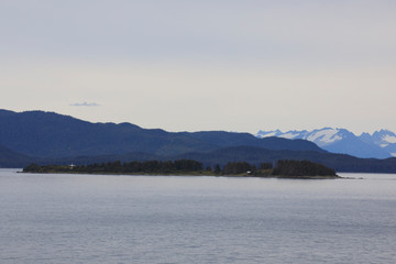Alaska / USA - August 15, 2019: Alaska coastline view from a cruise ship deck, Alaska, USA