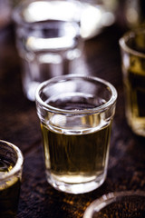 small glass of alcohol, rum, gin, tequila, drip, cachaça, sake or spirits.