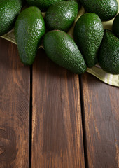 avocado on dark wooden surface
