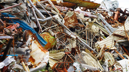 dump of rusty metal. metal structures and scrap metal texture. non-ferrous scrap in rust under the open sky. metal processing ecology and industry