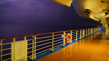 deck of a ship sailing on the sea. cruise liner walking deck. lifeboats, rafts and lifebuoys on the...