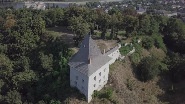 Aerial view of ruined medieval Halych Castle on the hill at sunny day, Halych, Ivano-Frankivsk region, Ukraine
