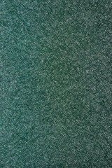 Beautiful shiny emerald surface with a fine pattern.