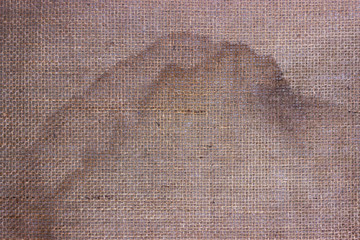 Loose fabric on the underside of the carpet.