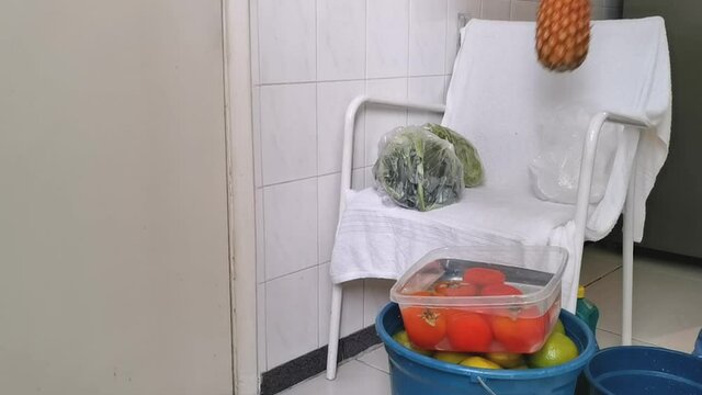 Quarantine. Pandemic. Woman unpacks and disinfects the fruits and vegetables so that her family is not contaminated. Taking care of viruses. 
