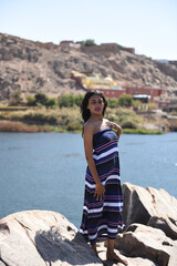 Spectacular middle eastern young woman is posing on  the Nile 