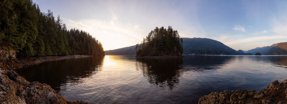 Beautiful Panoramic View of the Canadian Landscape during a vibrant winter sunset. Hike on Jug Island Trail in Belcarra, Vancouver, British Columbia, Canada. Nature Panorama Background © edb3_16