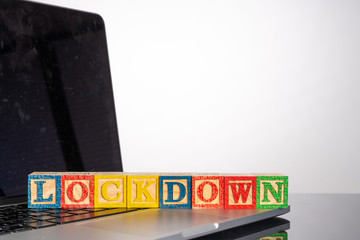Lockdown letter in wooden cube with healty concept.