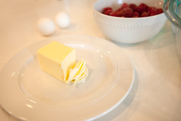 eggs and butter and raspberries and other baking ingredients