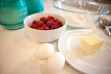 eggs and butter and raspberries and other baking ingredients