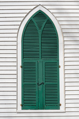 green shutters on a church