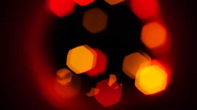 Cicular Colorful Bokeh Different Colors, slow flashing light. Exagonal bokeh color change with circular ring.