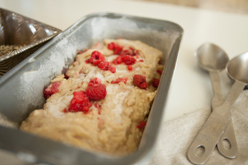 sweet raspberry bread batter in a loaf pan before baking