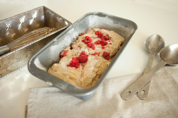 sweet raspberry bread batter in a loaf pan before baking