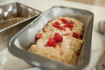 sweet raspberry bread batter in a loaf pan before baking