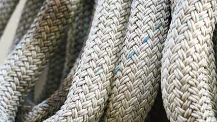 wicker rope texture. ship mooring rope composition. white synthetic rope macro photo