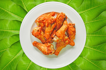 Ceramic dish of fried chicken drumstick for dinner