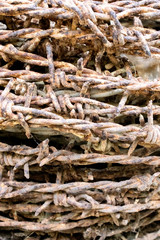 old rusty barbed wire background.