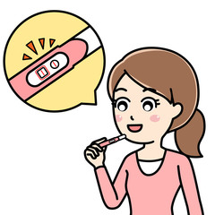 妊娠検査で陽性と出て喜ぶ女性